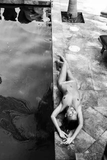 Marisa Papen lying nude poolside