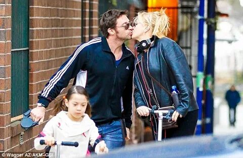 Hugh Jackman and wife Deborra-Lee share a kiss one day befor