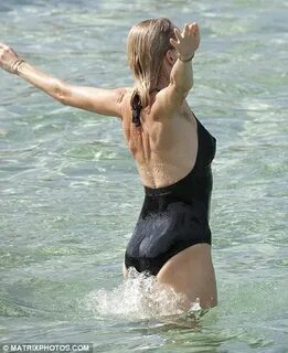 Naomi Watts enjoys a sunny day on a Sydney beach with her yo