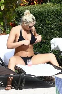 Brooke Hogan shows off her curves in a tiny black bikini at 