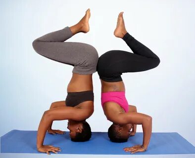 Two Yoga Partners Doing Headstand Pose - High Quality Free S