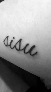 Inner arm tattoo of the word Sisu, which is a Finnish word t
