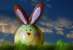 Funny easter bunny figurine on green grass free image downlo