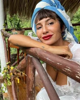 Jackie Cruz Shows Her Sexy Legs and Tits in a White Dress (5 Photos) .