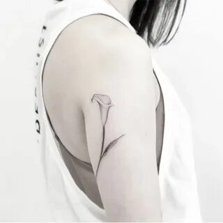 Calla lily in black #nyctattoo #nyctattooshop #nyctattoos #f