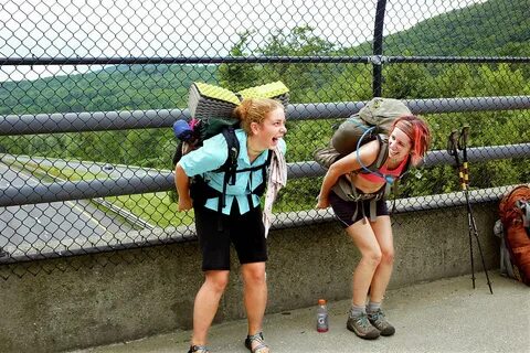 Two Hikers Mooning Traffic On I 90 Photograph by Michael D. 