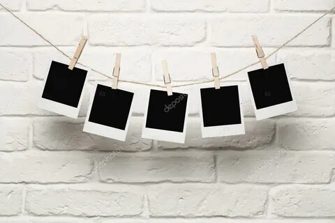 Blank photos hanging on a clothes line Stock Photo by © Rang