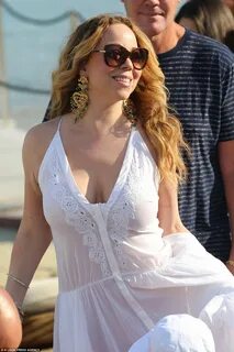 Mariah Carey goes underwear free on romantic trip with James