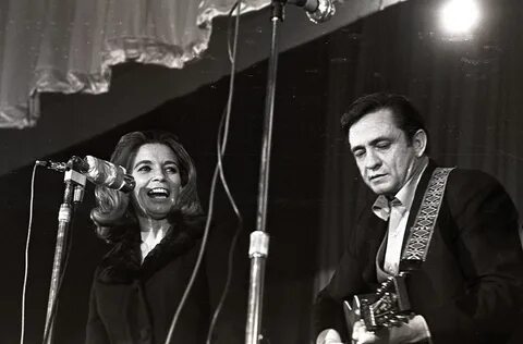 June Carter Cash and Johnny Cash perform live on stage - Jun