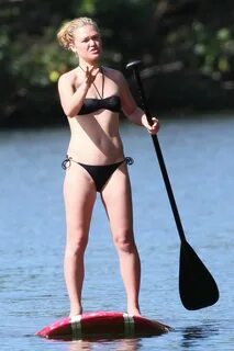 Julia Stiles in sexy black bikini paddle surfing in Maui