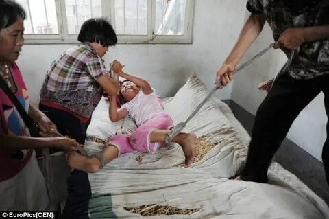 Shocking images of Chinese girl, 12, tied to her bed by her 