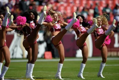 Washington Redskins cheerleaders perform before an NFL football game betwee...