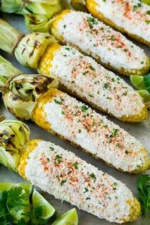 Mexican street corn with mayonnaise, crema, cotija cheese an