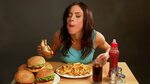 Video Stok woman eating fast food girl absorbs (100% Tanpa R
