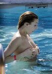 Whitney Port showing off her boobs bursting out of a bikini 