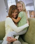Mother and Daughter Hugging on a Chair 5 Minutes for Faith