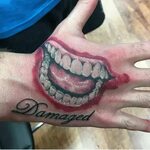 Joker Smile On Hand Tattoo - englshwer