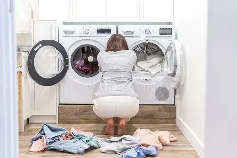 Sad Woman Sitting in a Laundry Room Stock Photo - Image of c