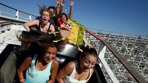 Topless on roller coaster.