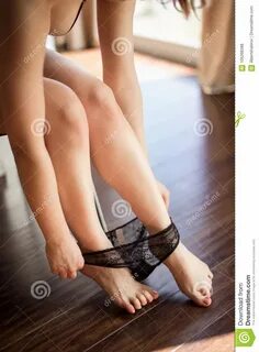 Young Woman Taking Off Beautiful Black Panties Stock Photo -