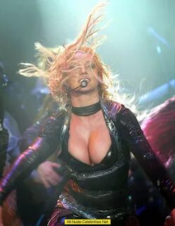 Britney Spears shows deep cleavage and areola slip on the stage.