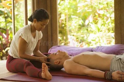 Young Beautiful and Exotic Asian Thai Therapist Woman Giving