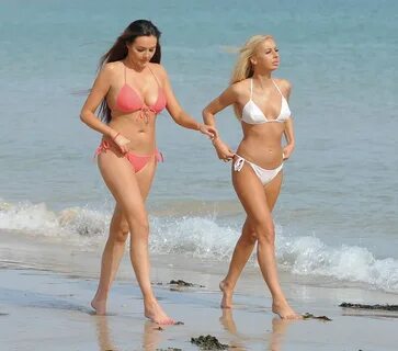 SARAH GOODHART and HOLLY RICKWOOD in Bikinis at a Beach in I