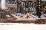 Kristen Hancher caught topless at the beach in Tulum during 