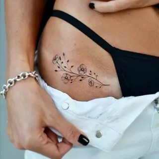 Super hot tiny flower tattoo on the right hip Flower hip tat