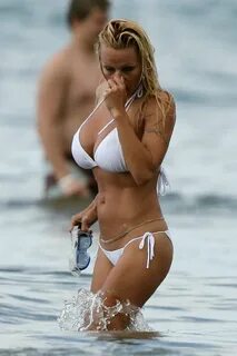 Pamela Anderson Playing in a White Bikini in Beach. Hollywoo