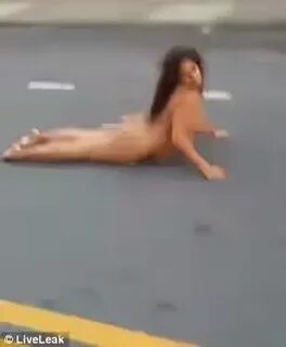 Intoxicated woman is captured on camera rolling in the stree