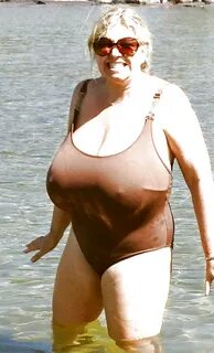 Old woman pic with boobs hanging in bathing suit bottom