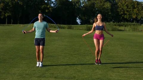 Guy and girl are jumping on the jump rope. Physical educatio