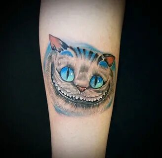 Тату чеширский кот на руке - фото салона Tattoo Times, узнай
