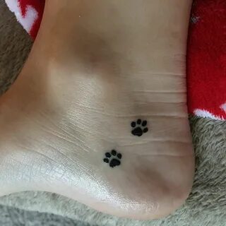 Just got this tattoo. Small paw prints on the inside my foot