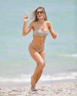 Bikini Bombshell Joy Corrigan Strikes Sexy Poses on a Beach 