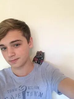 Dean Charles Chapman with a mini Dragon, don't know what's c