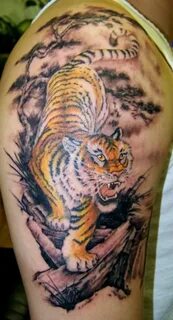 Large colored crawling tiger tattoo on shoulder Tiger tattoo