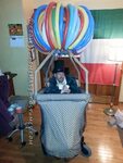 Crowd Rousing Wizard of Oz in a Hot Air Balloon Wheelchair C
