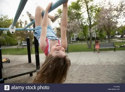 Girl hanging upside down on High Resolution Stock Photograph