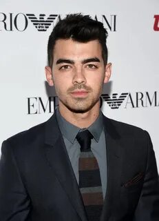 Joe Jonas Completes Sharp Emporio Armani Suit Look with Knit