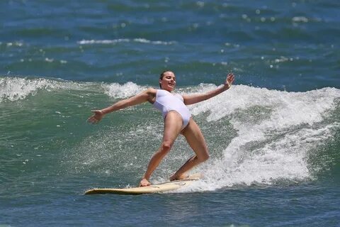 MARGOT ROBBIE in Swimsuit Surfing in Hawaii 07/19/2016 - Haw