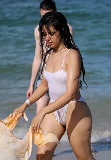 Camila Cabello in White Swimsuit on the beach in Miami Beach. 