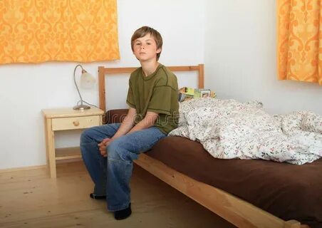 Boy sitting on bed stock image. Image of featherbed, sleep -