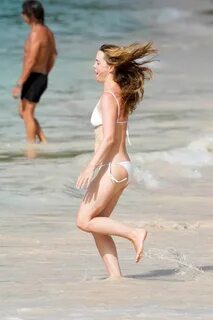 melissa george wears a white bikini while enjoying a beach d