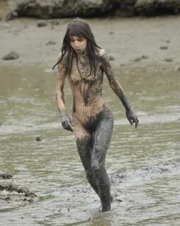 Naked girls in mud.