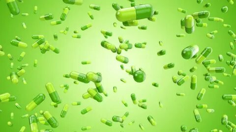 Green Pills Constantly Falling Against Stockowy materiał wid