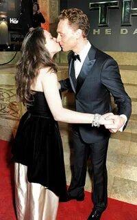 Tom delivered a kiss to Kat Dennings. Take a Moment to Appre