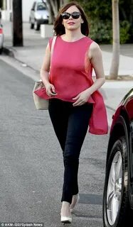Rose McGowan matches her bra to her top as she flashes lacy 