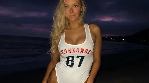 Camille Kostek wears a Gronk swimsuit ahead of the Super Bow